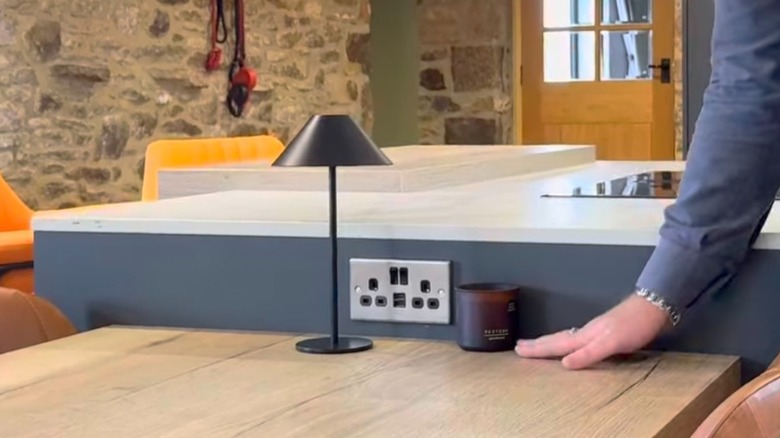 outlet on the side of a split-tier kitchen island