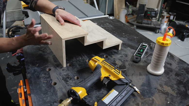 a tiered shelf for a pantry being built in a woodshop