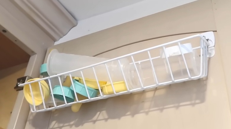 Wire organizer hanging on Command hooks on the door