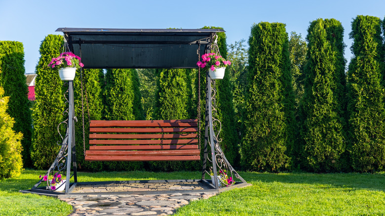 Wooden swing chair with covering