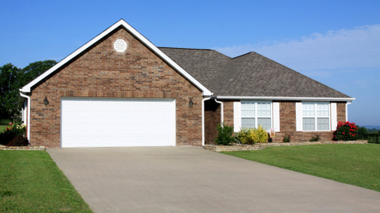 Brick house with a concrete driveway