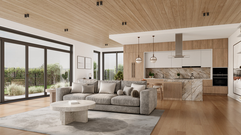 Wide shot of living room with wood plank ceiling