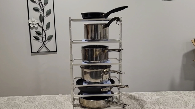 LAMU's Pots and Pans Organizer loaded with pans on a kitchen counter