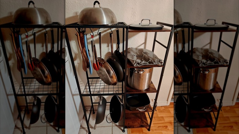 Various pots, pans, and utensils stored on OMISRUIS' 5-Tier Pot and Pan Organizer Rack