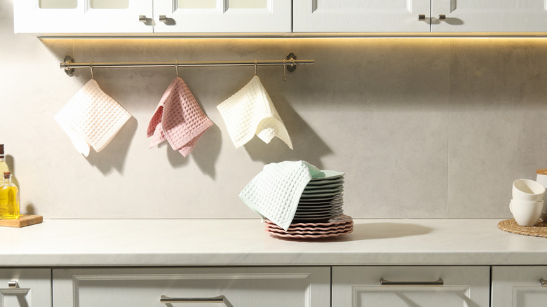 towel rack in kitchen mounted under cabinets