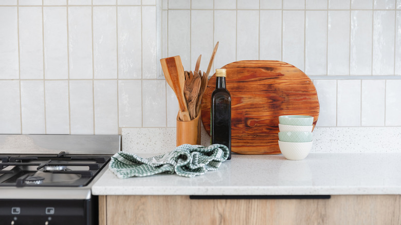 green and white towel crumpled on kitchen counter