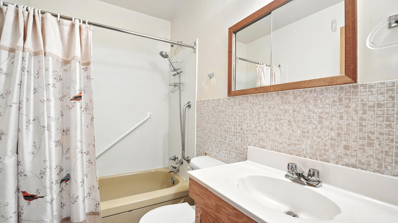 brown bathroom with shower curtain