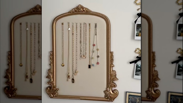 Antique gold gilded frame with hanging necklaces