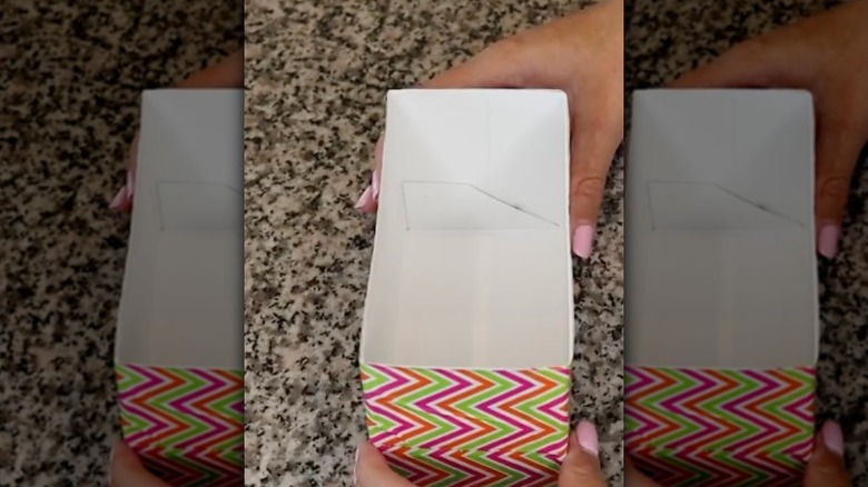 A box full of neatly arranged tea bags in a drawer.