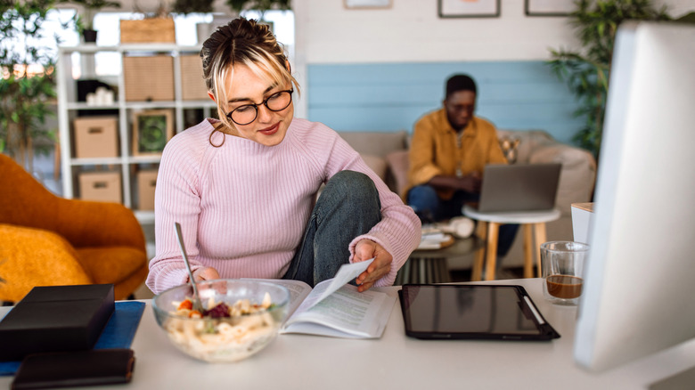 woman eating at her desk