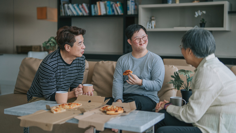 family eating at coffee table