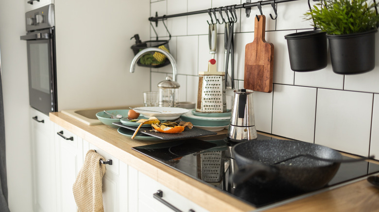 A cluttered kitchen counter