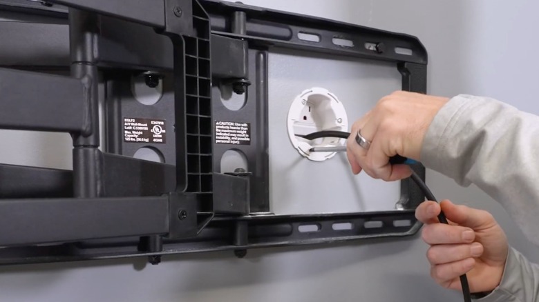 cords concealed in the wall for a wall-mounted TV