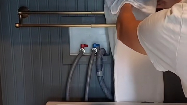 TikTok user showing towel bar installation