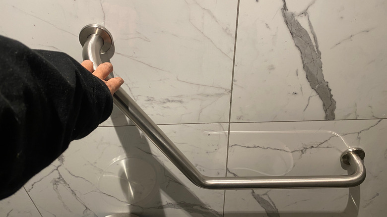 A bathroom with a grab bar