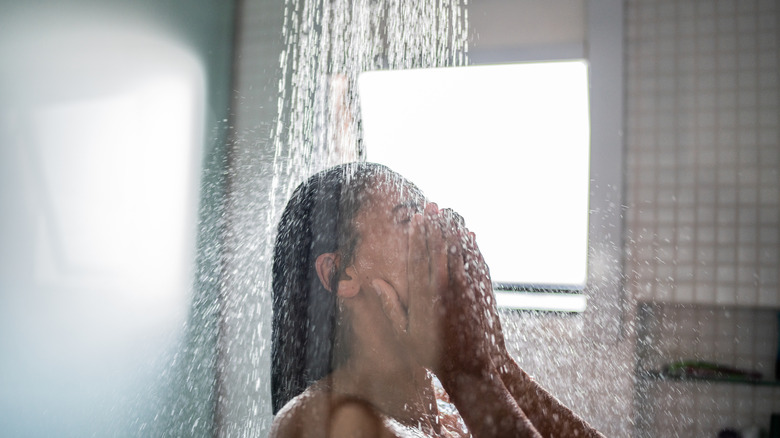 A woman taking a shower