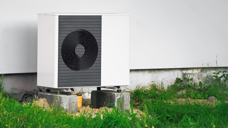 Geothermal heat pump installed in backyard