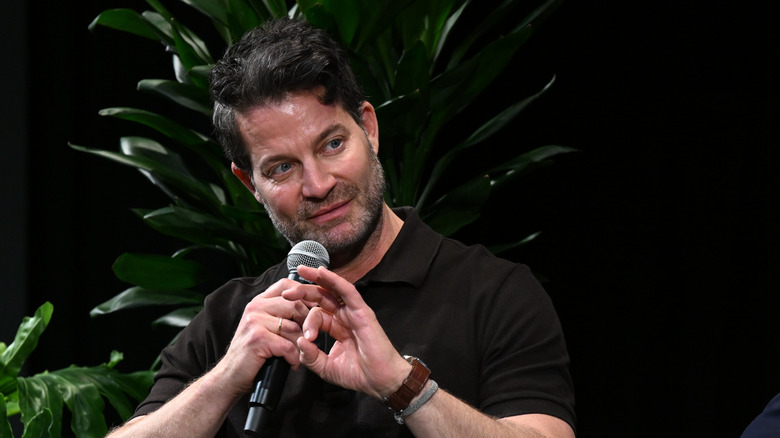 Nate Berkus holding a microphone