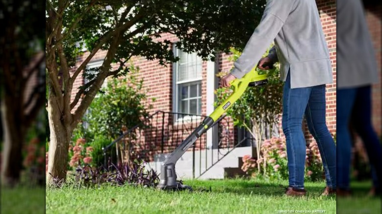 RYOBI string trimmer in use in yard