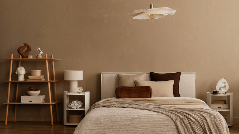 bedroom iwith greige walls and warm neutral accents throughut