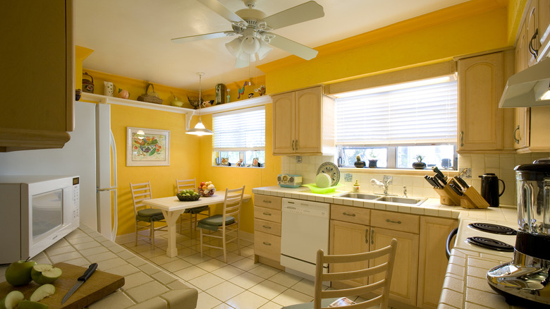 Large kitchen painted sunny yellow.