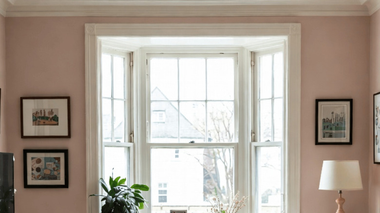 Sunny room with pale pink walls.