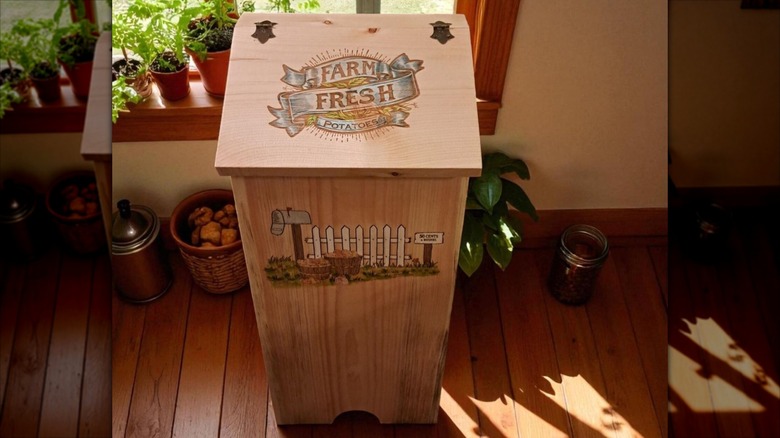 A painted potato wood bin
