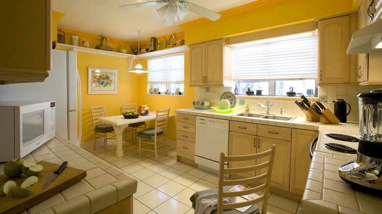 Large kitchen painted sunny yellow.