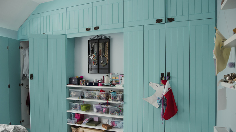 Closets painted pale aqua.