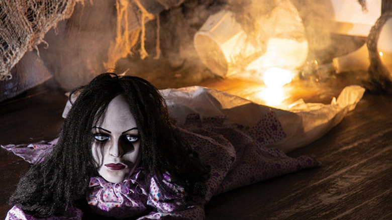 Creepy woman crawling on the ground 