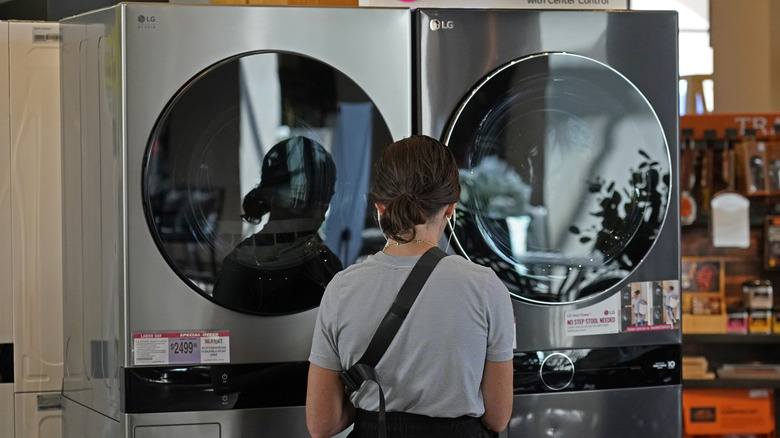 Woman loooking at LG Dryer