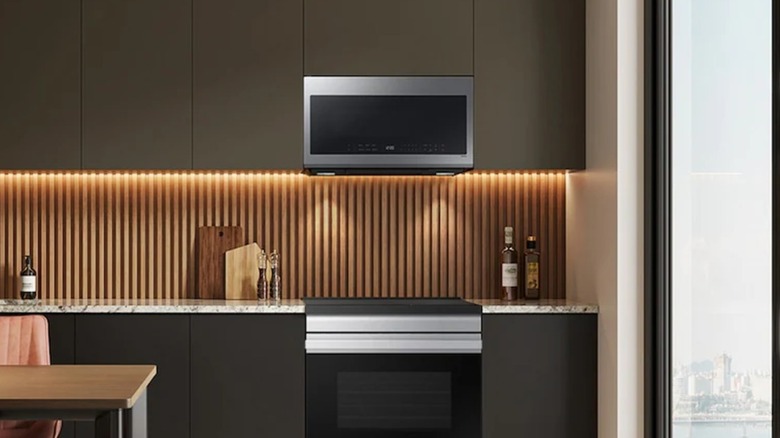 A stainless steel over-the-range microwave in a kitchen