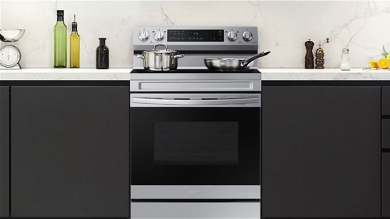 A black and stainless steel range in a kitchen