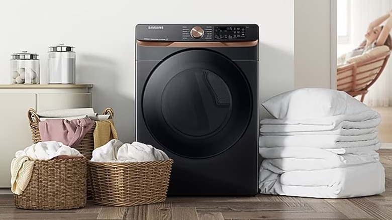 A black Samsung clothes dryer in a laundry room