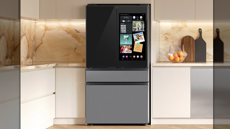 A 4-door French door fridge with a large screen on the right side
