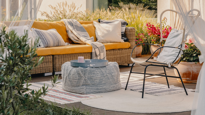 Cozy outdoor patio with rugs