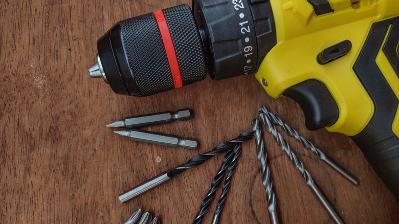 a Cordless drill with assorted drill and screwdriver bits