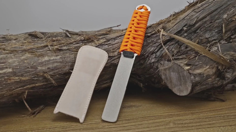 A SHARPAL 181N dual-grit diamond sharpening stone file lying on wood.