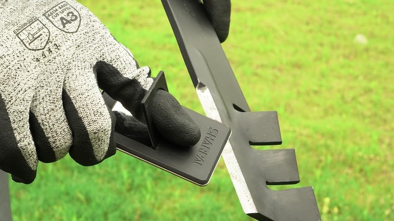 Sharpening a mower blade with the Sharpal available from Amazon