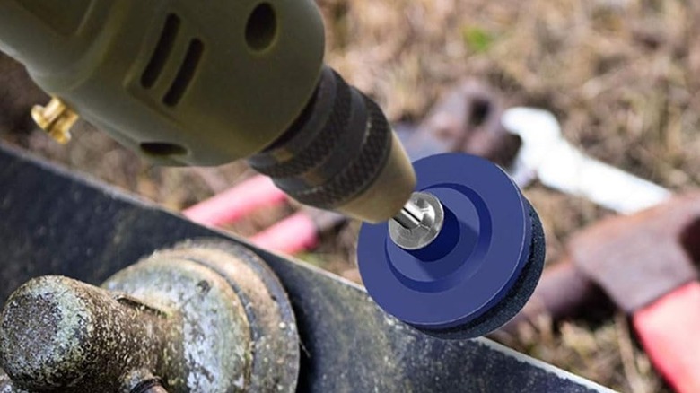 Using a mower blade sharpener on a power drill