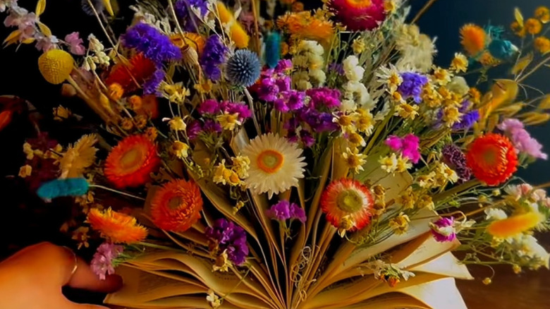 A floral book display for a table or centerpiece