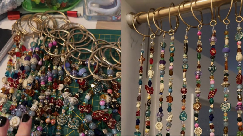 Assorted beads and shower curtain rings assembled to create a beaded curtain