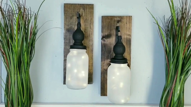 Two wall sconces made from Mason jars