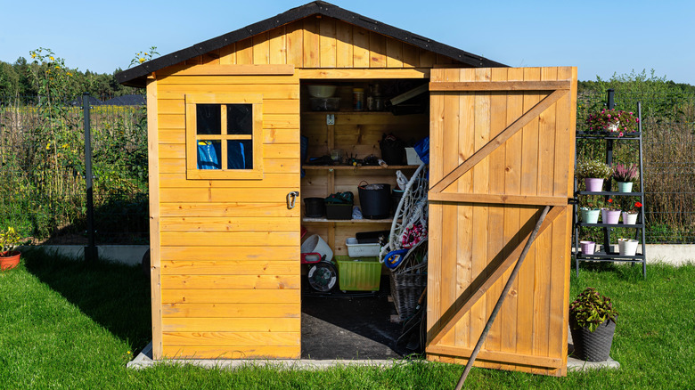 Yellow shed with concrete slab shed foundation