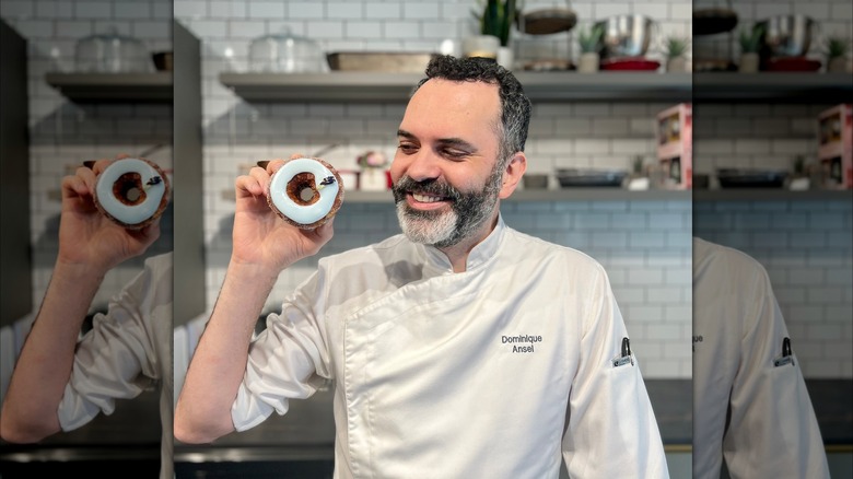 Chef Dominque Ansel smiling with cronut