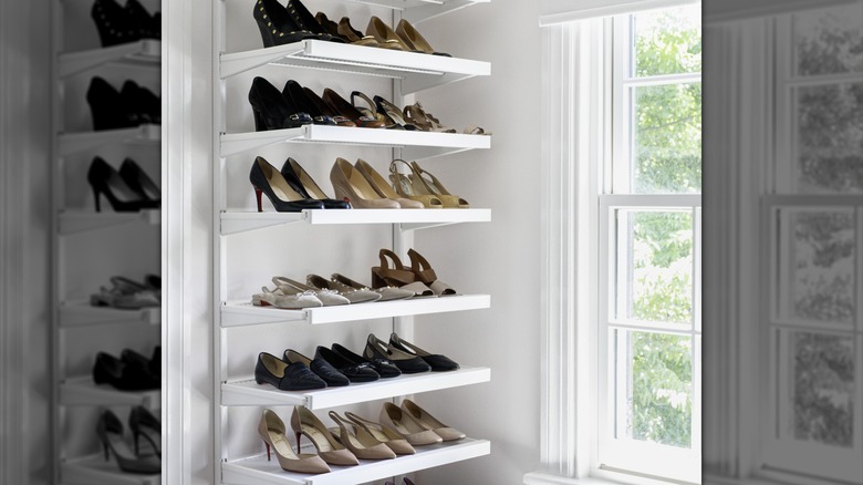 High heel shoes on display on an open shoe rack