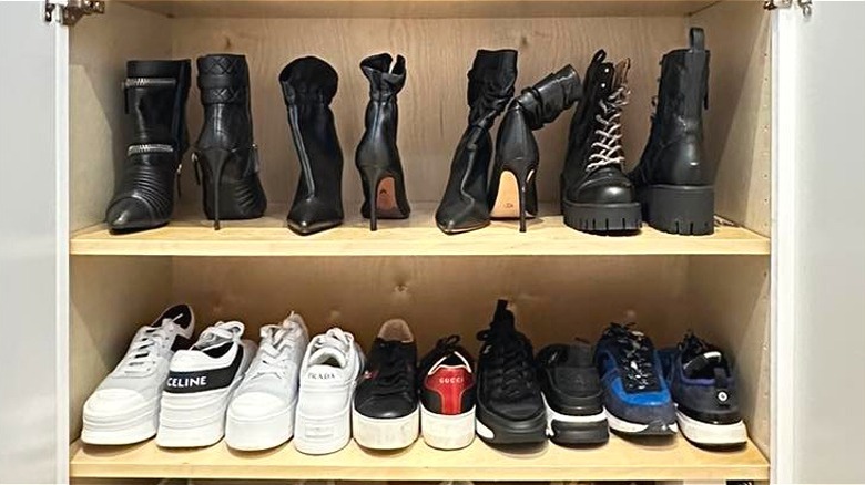 Boots and sneakers arranged heel-to-toe to save space on shelves