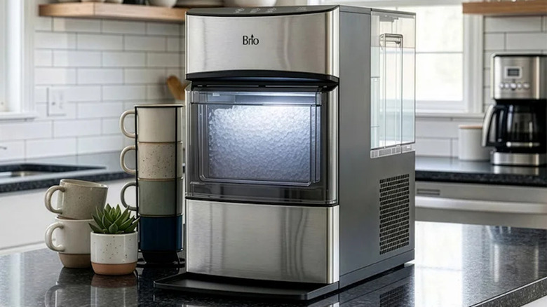 A countertop icemaker sitting on a kitchen island