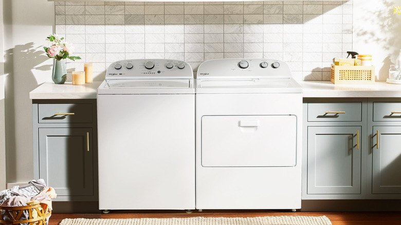 A washer and dryer in a brightly lit laundry room