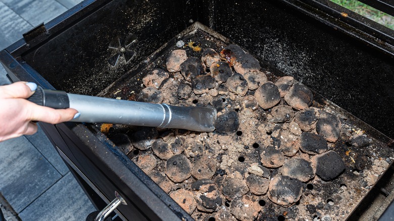 cleaning ash from charcoal grill